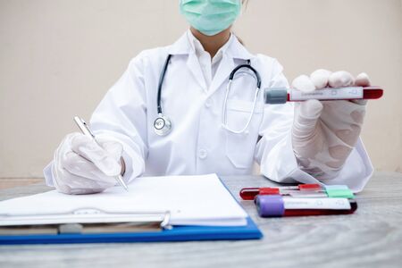 Professional doctors perform COVID-19 tests from samples of blood tests to diagnose coronary virus infections analysis and sampling of infectious diseases, medical concepts and health care.の写真素材