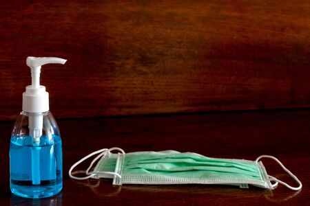 Picture of medical surgical mask and alcohol hand sanitizer, wash dirt to prevent germs.の写真素材