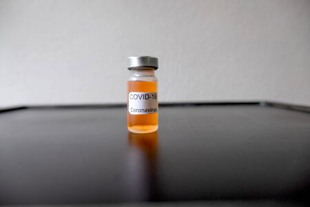 Professional doctors perform testing and analyzing samples of COVID-19 vaccines for immunization prevention and treatment from viral infections. Medical and health care concepts.の写真素材