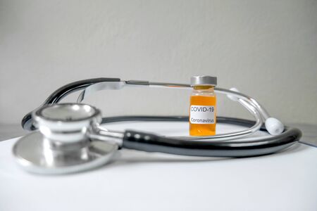 Professional doctors perform testing and analyzing samples of COVID-19 vaccines for immunization prevention and treatment from viral infections. Medical and health care concepts.の写真素材