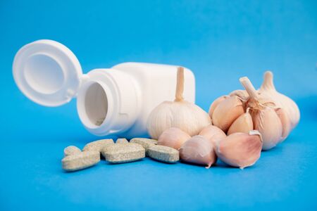 Garlic extract capsules herb. Dietary supplements nourish the body.の写真素材