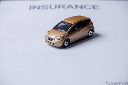 Car placed on insurance documents. Car insurance concept.の写真素材