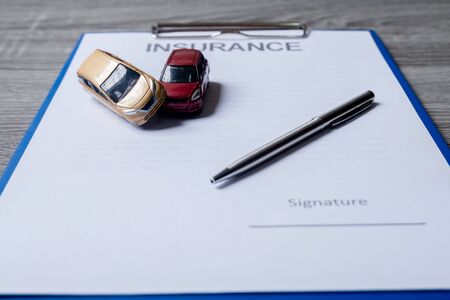 Car and pen on insurance documents. Car insurance concept.の写真素材