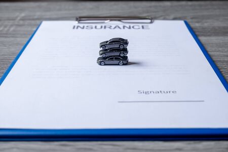 Car placed on insurance documents. Car insurance concept.の素材 [FY310147424985]