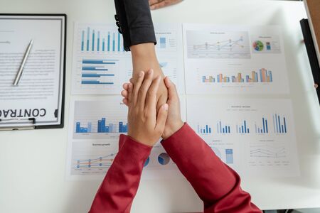 Shaking hand, Two business leader discussing the charts and graphs showing the results, Planning to...