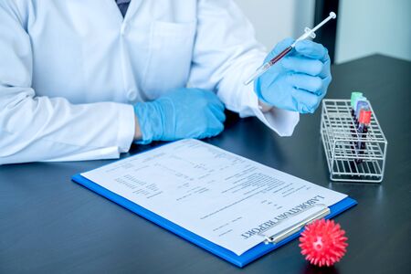 Professional doctors perform find virus tests from samples of blood tests to diagnose coronary virus infections analysis and sampling of infectious.の写真素材