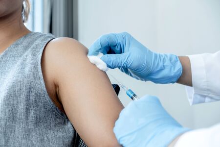 doctors vaccinated with syringes to prevent epidemics at hospitals, health care and medical...