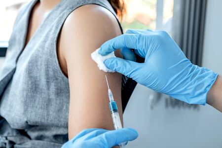 doctors vaccinated with syringes to prevent epidemics at hospitals, health care and medical...