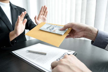 The businessman denies the money in proposed by his partner to bribe the concept of bribery and corruption.の写真素材