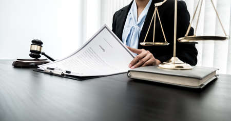 Professional women lawyers work at a law office There are scales, Scales of justice, judges gavel,...