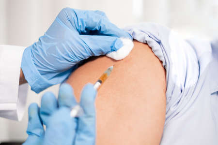 Female doctors vaccinated with syringes to prevent epidemics at hospitals, health care, and medical concepts.の写真素材