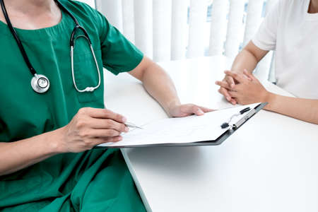 Male doctors explain and recommend treatment after a male patient meets a doctor and receives results regarding illness problems. Medical and health care concepts.の写真素材