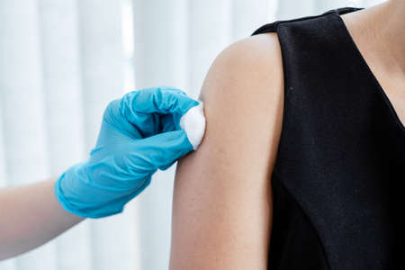 Male doctors vaccinated with syringes to prevent epidemics at hospitals, health care, and medical concepts.の写真素材