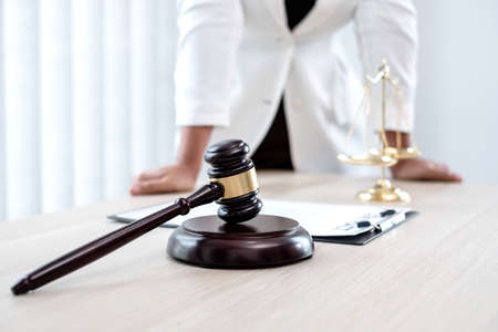 Professional women lawyers work at a law office There are scales, Scales of justice, judges gavel, and litigation documents. Concepts of law and justice.の写真素材