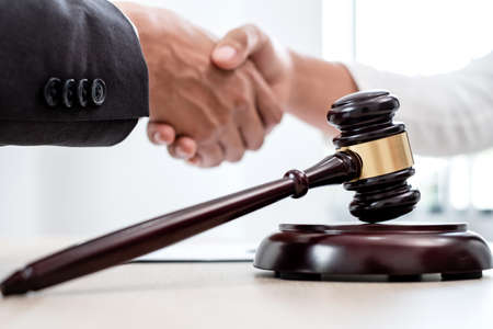 shake hand Professional male lawyers work at a law office There are scales, Scales of justice,...