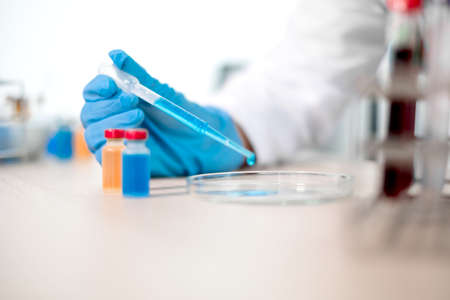 Professional doctors perform testing and analyzing samples of vaccines for immunization prevention...