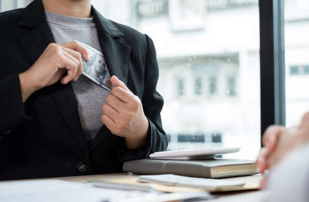 Businesswoman makes an agreement with the money proposed by his partner to bribe in the company. The...