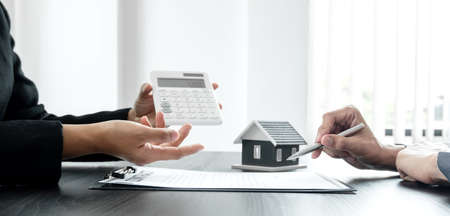 Real estate agents have a rental contract form for customers to sign a contract by the formal rental agreement Rental and insurance concepts.の写真素材