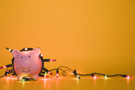 Piggy bank with party light, organize a party for the event were successful in saving money for use in various festivals.の写真素材