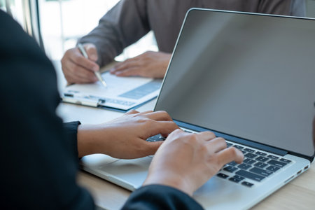 Business people hold a resume and talk to job applicants for job interviews about careers and Her personal history in the company. Recruitment concepts.の写真素材