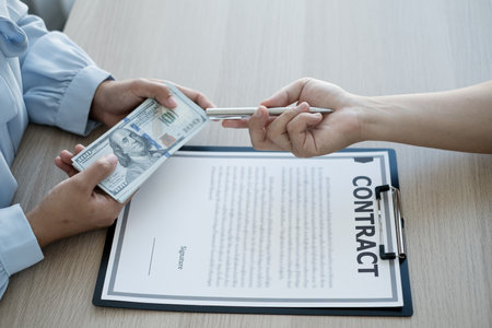 The owner's business personally signed the deal closing the deal by accepting bribes. The concept of bribery and corruption.の写真素材