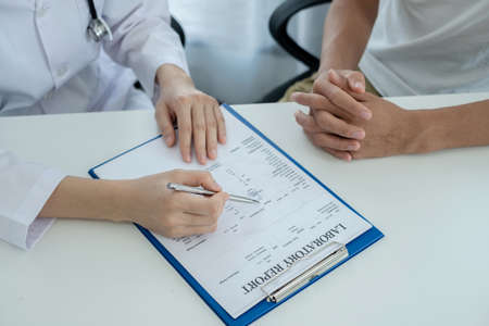 Female doctors who treat patients make an appointment to listen to the results after a physical...