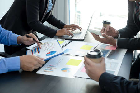 Meeting business team leaders about charts, financial graphs showing results are analyzing and...