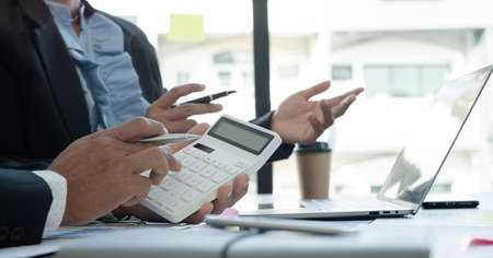 Meeting business team leaders about charts, financial graphs showing results are analyzing and calculating planning strategies, business success building processes.の写真素材