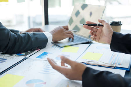 Meeting business team leaders about charts, financial graphs showing results are analyzing and...