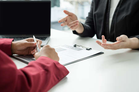 Business people hold a resume and talk to job applicants for job interviews about careers and Their...