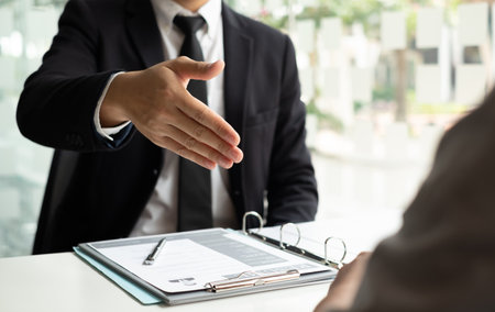 Business people hold a resume and talk to job applicants for job interviews about careers and Their personal history in the company. Recruitment concepts.の写真素材