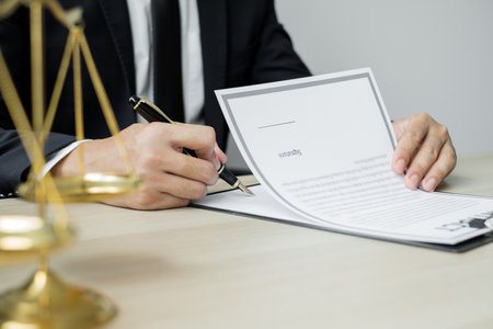 Professional male lawyers work at a law office There are scales, Scales of justice, judges gavel, and litigation documents. Concepts of law and justice.の写真素材