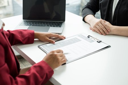 Business people hold a resume and talk to work applicants for work interviews about careers and Their personal history in the company. Recruitment concepts.の写真素材