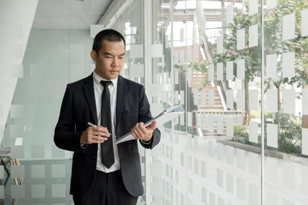 Business people hold a resume for applicants for work interviews about careers and Their personal history in the company. Recruitment concepts.の写真素材