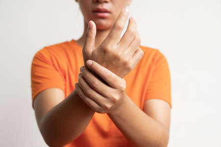 Woman hand with numbness and pain in the palm of the hand has pain and tingling in the nerve endings. which is a side effect of Guillain-Barre Syndrome after vaccination.の写真素材