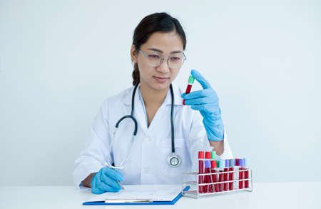 Professional doctors perform tests from samples of blood tests to diagnose virus infections analysis...