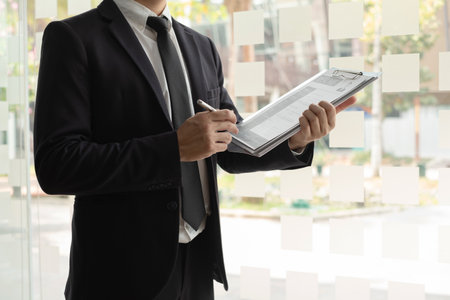 Business people hold a resume and talk to job applicants for job interviews about careers and Their...