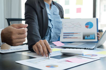 Meeting business team leaders about charts, financial graphs showing results are analyzing and calculating planning strategies, business success building processes.の写真素材