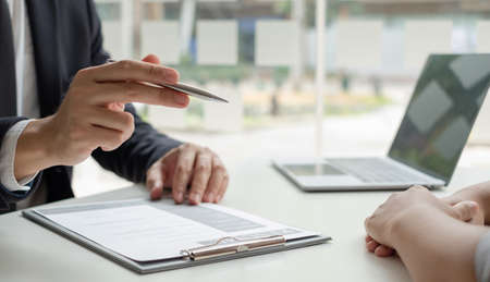 Business people hold a resume and talk to job applicants for job interviews about careers and Their...