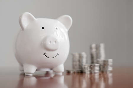 piggy bank with golden coins pile, step up growing business to success, and saving for retirement...