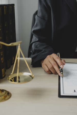 Professional woman lawyers work at a law office There are scales, Scales of justice, judges gavel,...