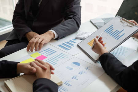 Business leaders talk about charts, financial graphs showing results are analyzing and calculating planning strategies, business success building processes.の写真素材