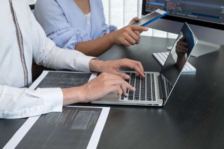 Team of programmers working with computer programming, professional development, and coding...