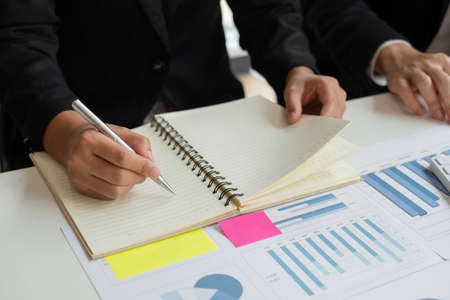 Business leaders talk about charts, financial graphs showing results are analyzing and calculating...