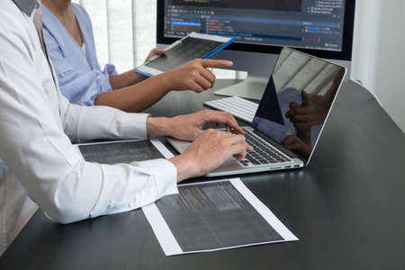 Team of programmers working with computer programming, professional development, and coding...