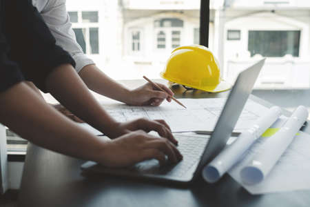 Team of engineers and architects, working team, meeting, discussing construction and drawing...