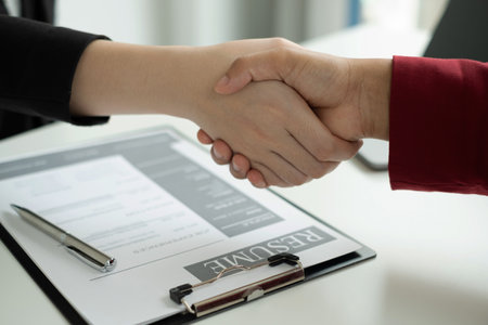 Employer shake hand with job applicants congratulates and welcomes new hires after successful negotiations for a job interview. Recruitment concepts.の写真素材