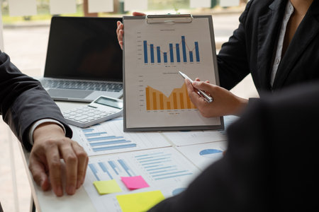 Business leaders talk about charts, financial graphs showing results are analyzing and calculating planning strategies, business success building processes.の写真素材