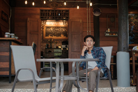 Young Asian businessman suffers from depression and stress is laid off due to economic problems feels hopeless has financial anxiety.の写真素材