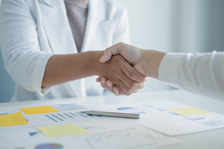 Business people shaking hands, finishing up a meeting. Business success concept.の写真素材
